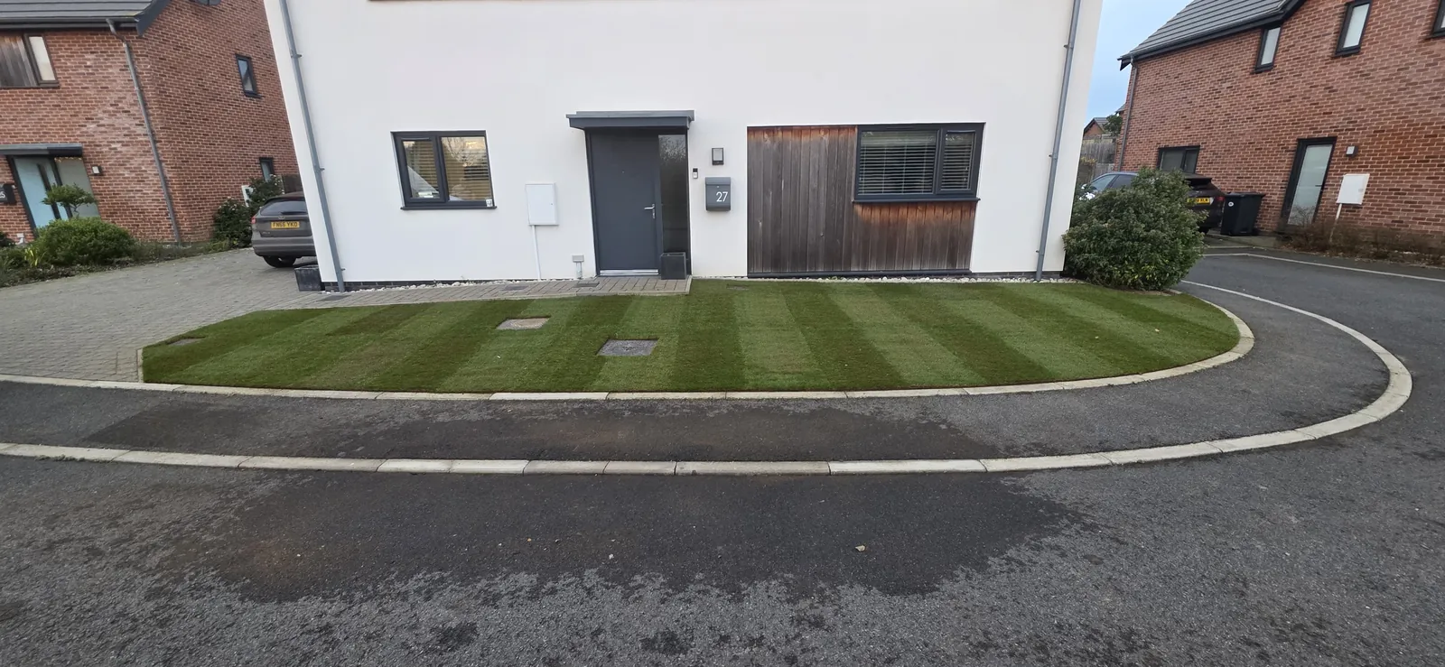 Freshly laid striped front lawn outside a Norwich home